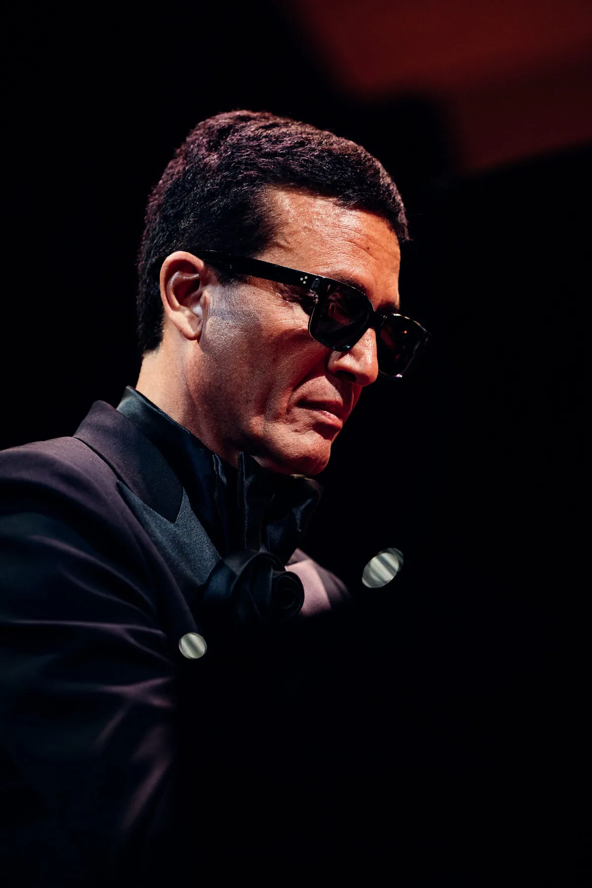 Omar Harfouch — a dark studio portrait